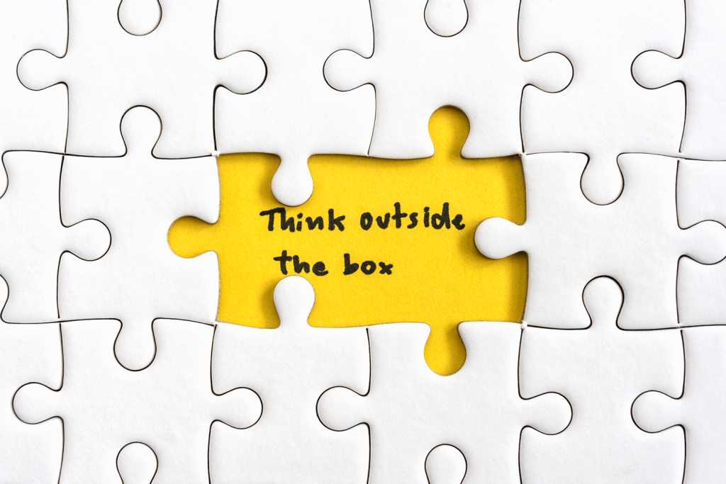 puzzle with written "think outside the box"